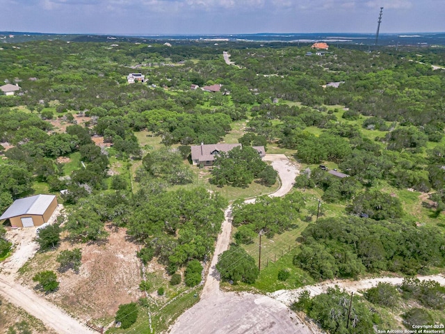 drone / aerial view with a view of trees