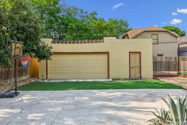 exterior space with fence and a garage