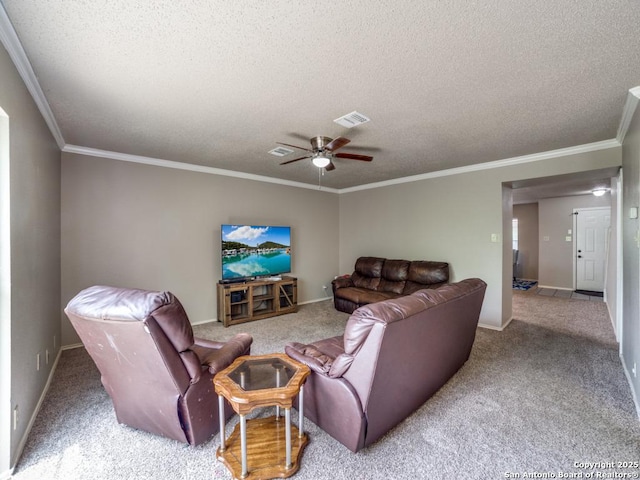 carpeted living room with visible vents, a ceiling fan, a textured ceiling, and ornamental molding