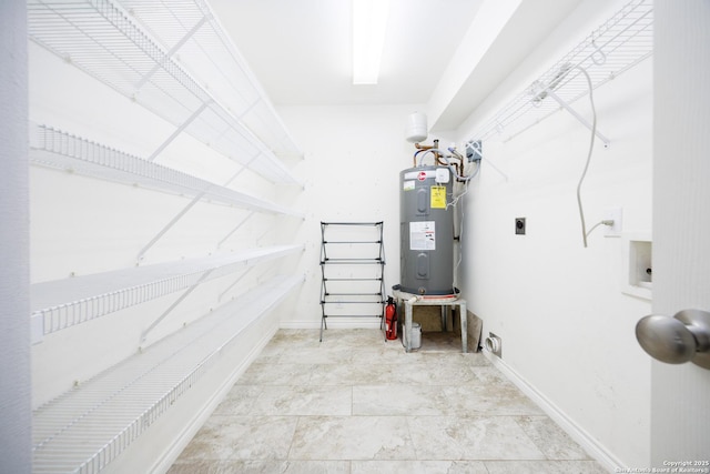 utility room featuring electric water heater