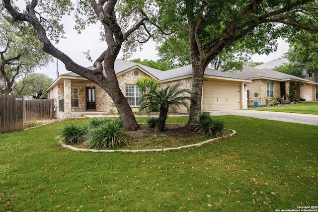 single story home with a front yard, fence, concrete driveway, an attached garage, and stone siding