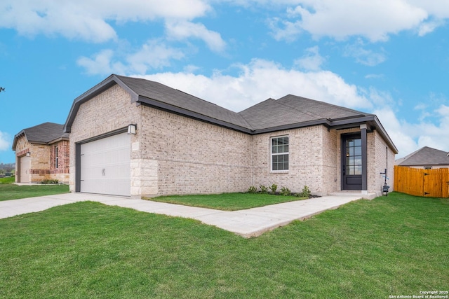ranch-style house featuring fence, a front yard, driveway, and brick siding