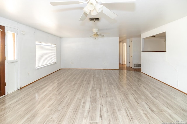 908 Broadway, Jourdanton, TX 78026 - unfurnished room featuring visible vents, ceiling fan, and light wood-type flooring
