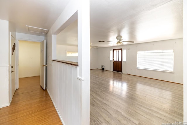 908 Broadway, Jourdanton, TX 78026 - interior space with baseboards, attic access, light wood-type flooring, and visible vents
