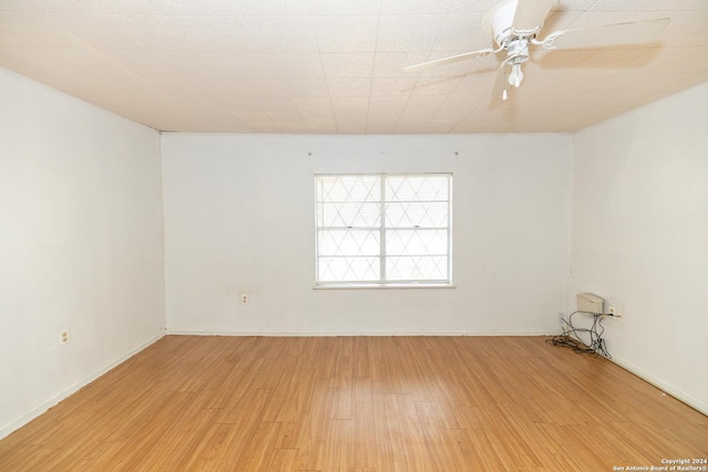 908 Broadway, Jourdanton, TX 78026 - empty room featuring ceiling fan, baseboards, and light wood-style floors