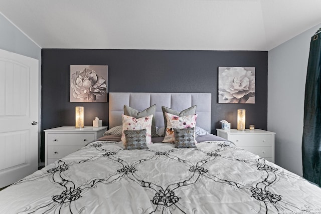 bedroom featuring lofted ceiling
