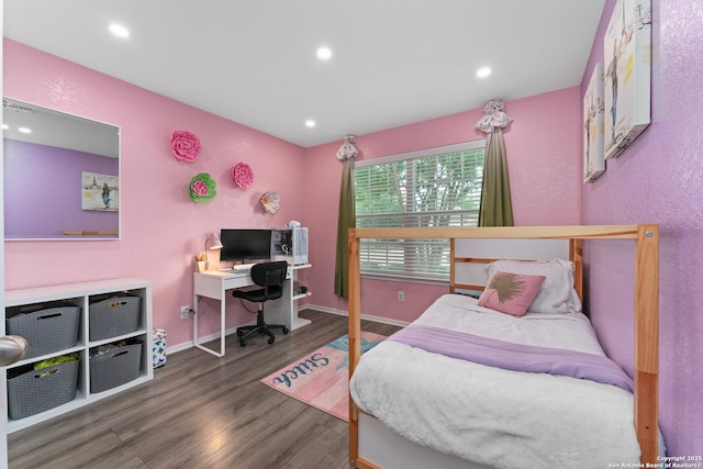 bedroom with recessed lighting, baseboards, and wood finished floors