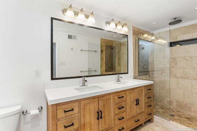 full bathroom featuring visible vents, a sink, crown molding, and a stall shower