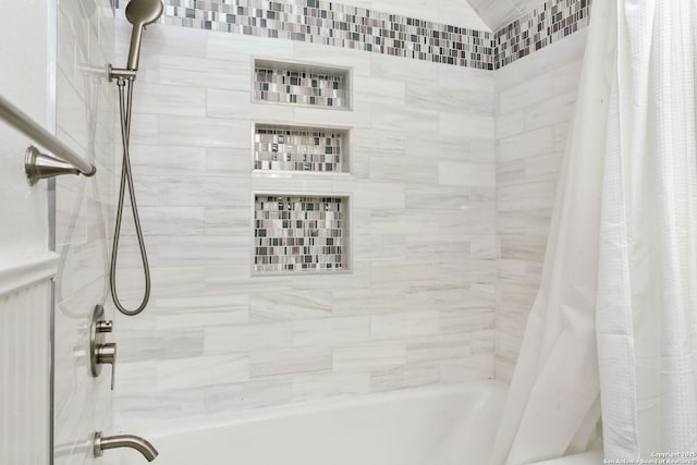 bathroom with shower / bathtub combination with curtain