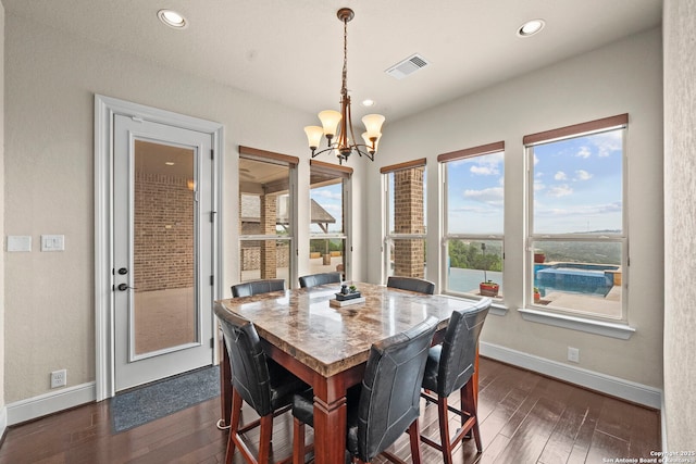 dining space with visible vents, dark wood-style flooring, baseboards, recessed lighting, and a notable chandelier