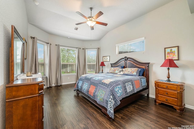 bedroom with visible vents, baseboards, dark wood finished floors, and vaulted ceiling