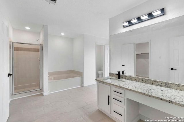 11202 Forest Pass, Live Oak, TX 78233 - bathroom with vanity, toilet, a bath, and a stall shower