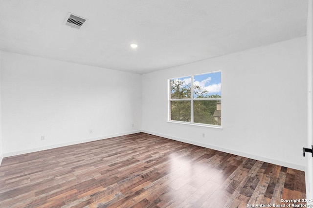 11202 Forest Pass, Live Oak, TX 78233 - unfurnished room featuring baseboards, recessed lighting, wood finished floors, and visible vents
