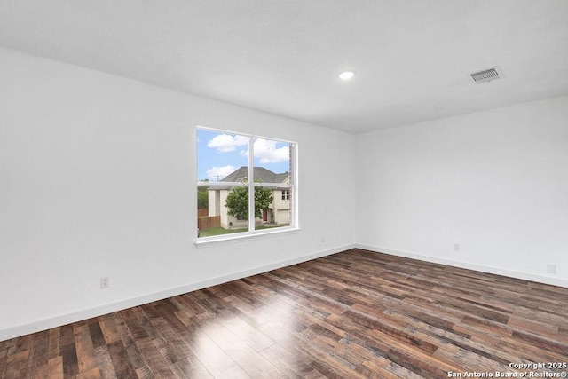 11202 Forest Pass, Live Oak, TX 78233 - unfurnished room with recessed lighting, baseboards, visible vents, and dark wood-type flooring