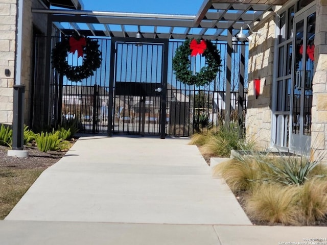 view of gate with fence