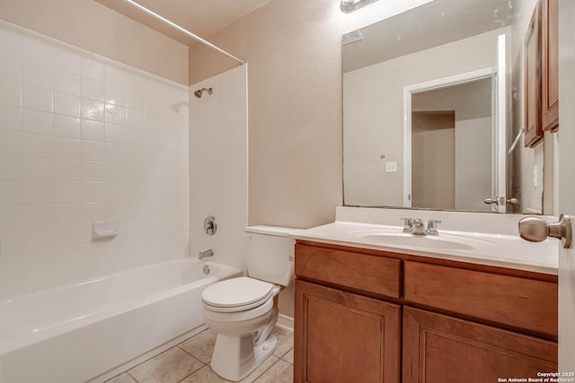 bathroom featuring a textured wall, tile patterned flooring, vanity, toilet, and bathing tub / shower combination