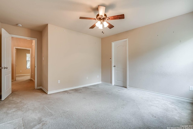empty room featuring baseboards, carpet, and ceiling fan