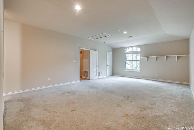 carpeted empty room featuring baseboards, recessed lighting, vaulted ceiling, and visible vents