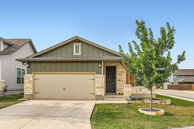 craftsman-style house with an attached garage, stone siding, board and batten siding, a front yard, and concrete driveway