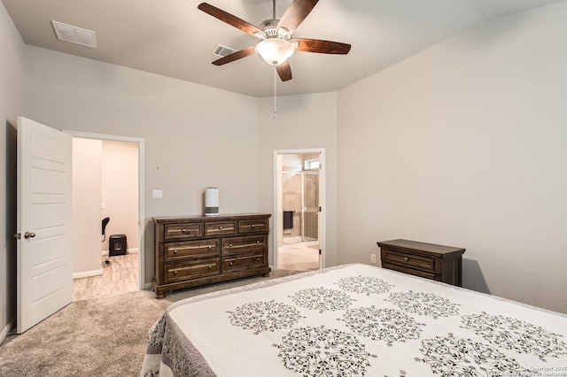 bedroom with visible vents, baseboards, a ceiling fan, carpet, and ensuite bath