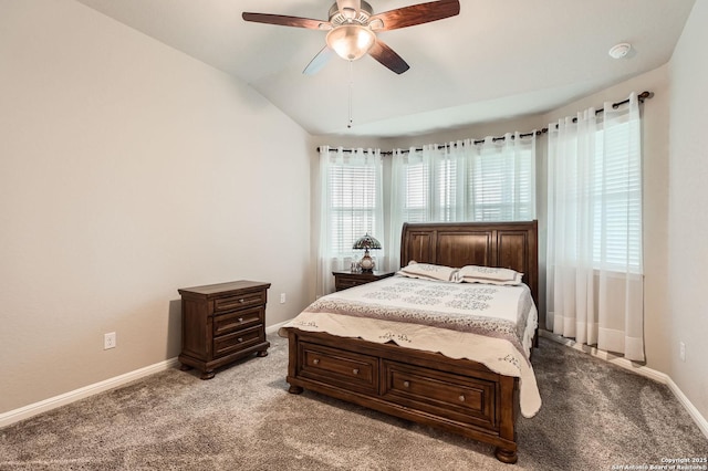 bedroom with vaulted ceiling, baseboards, and carpet flooring