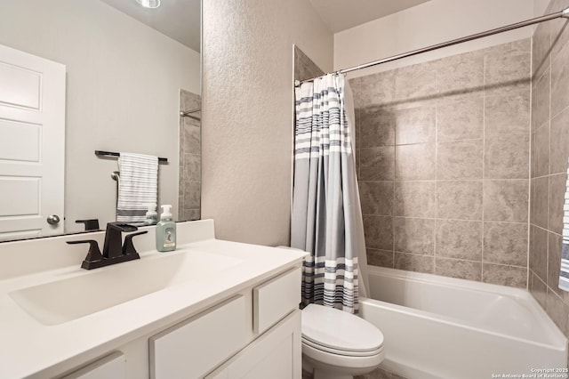 full bath with vanity, shower / tub combo with curtain, a textured wall, and toilet