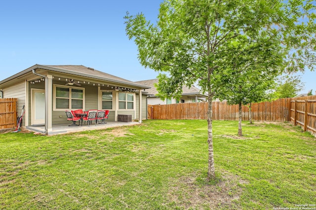 view of yard with a fenced backyard and a patio area