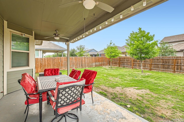 view of patio with ceiling fan, a fenced backyard, and outdoor dining space