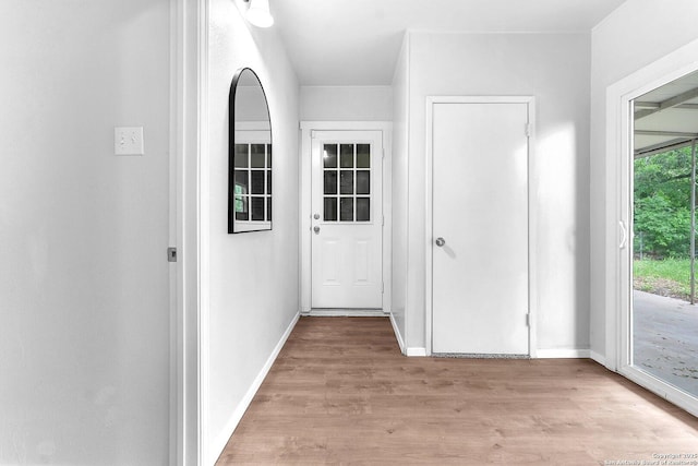entryway with baseboards and light wood-type flooring