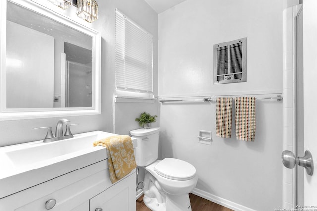 full bathroom with vanity, visible vents, wood finished floors, toilet, and walk in shower