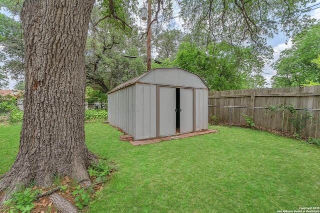 view of shed with a fenced backyard