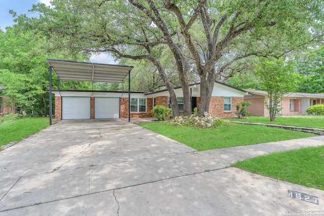 mid-century inspired home with brick siding, driveway, and a front yard