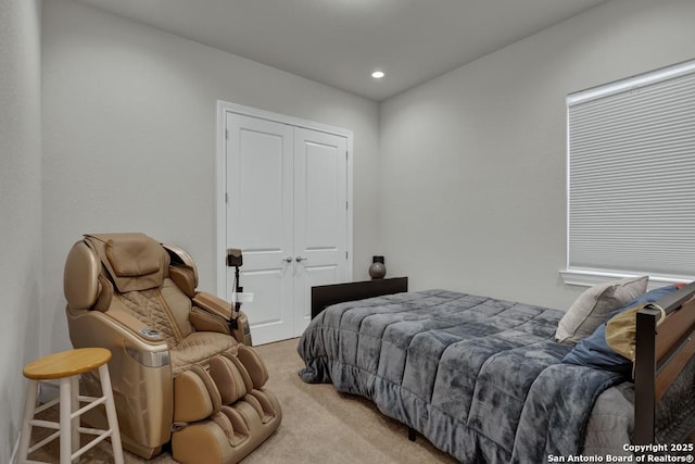 carpeted bedroom featuring a closet and recessed lighting