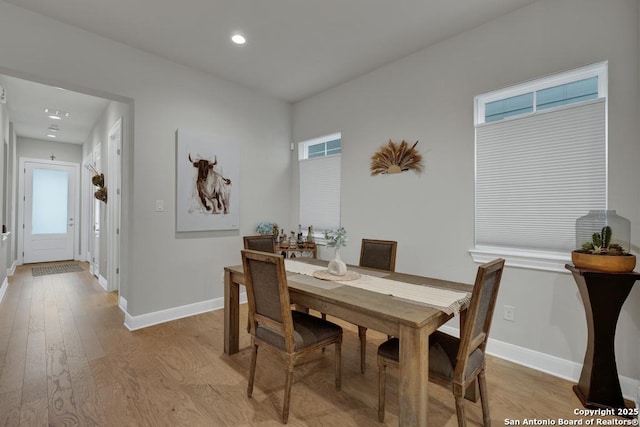 dining area with recessed lighting, baseboards, and light wood-style floors