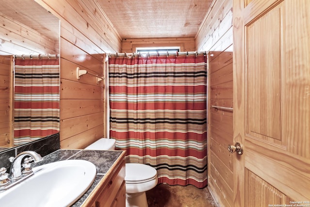 full bath with vanity, toilet, wood walls, concrete floors, and a shower with shower curtain
