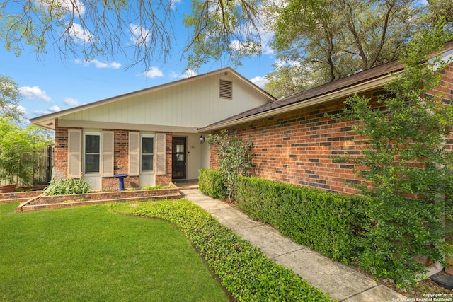 1901 Creek Mtn, San Antonio, TX 78259 - view of front of home featuring brick siding and a front yard