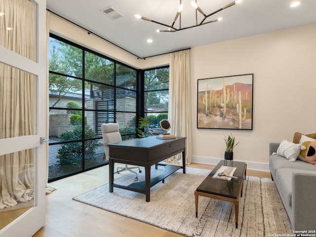 4701 Peralta Ln, Austin, TX 78735 - office area with recessed lighting, visible vents, wood finished floors, and an inviting chandelier