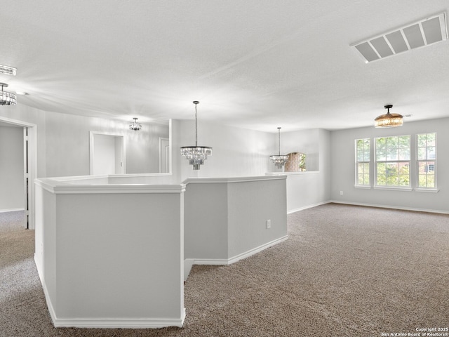 6027 Cedar Path, San Antonio, TX 78249 - kitchen with carpet floors, pendant lighting, visible vents, baseboards, and a chandelier