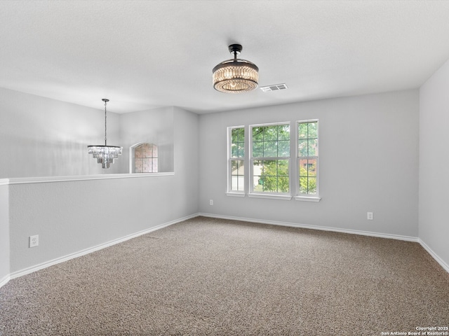 6027 Cedar Path, San Antonio, TX 78249 - empty room featuring visible vents, carpet, baseboards, and a notable chandelier