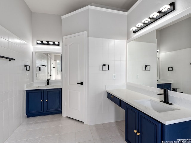 6027 Cedar Path, San Antonio, TX 78249 - bathroom with tile walls, a sink, and tile patterned flooring