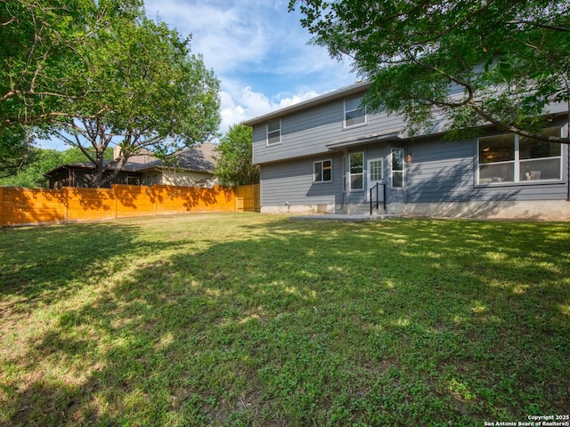 6027 Cedar Path, San Antonio, TX 78249 - rear view of property featuring a lawn and fence