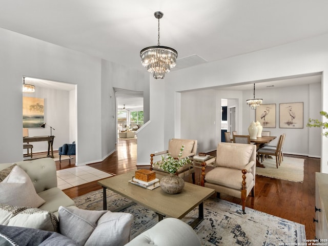 6027 Cedar Path, San Antonio, TX 78249 - living area with baseboards, wood finished floors, and a notable chandelier
