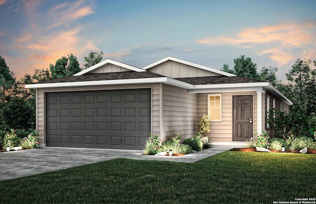 ranch-style house featuring a shingled roof, a garage, board and batten siding, concrete driveway, and a yard
