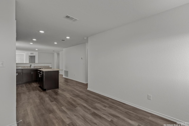 kitchen featuring visible vents, recessed lighting, dark wood finished floors, and baseboards