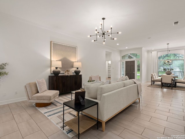 living area with crown molding, a notable chandelier, recessed lighting, baseboards, and visible vents