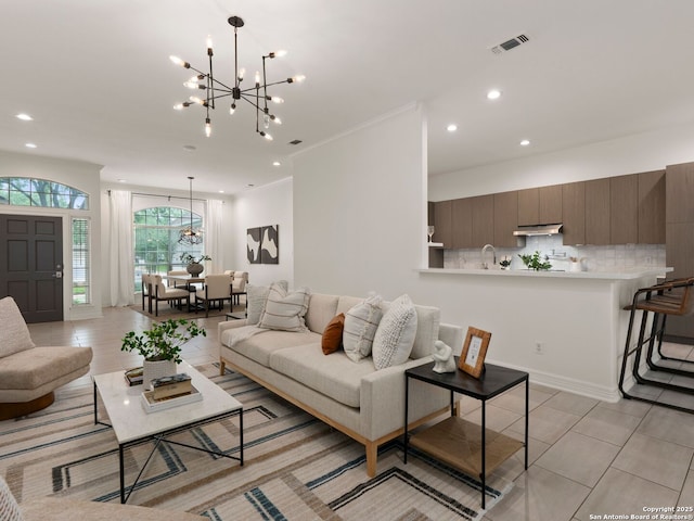 living area featuring visible vents, recessed lighting, light tile patterned flooring, and a chandelier