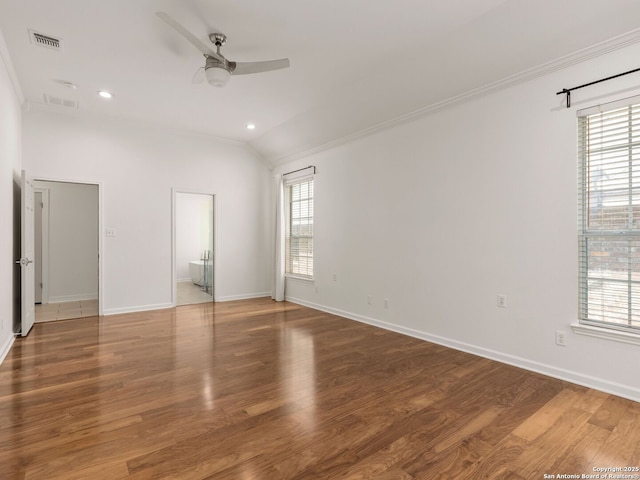 unfurnished bedroom with visible vents, ornamental molding, and multiple windows