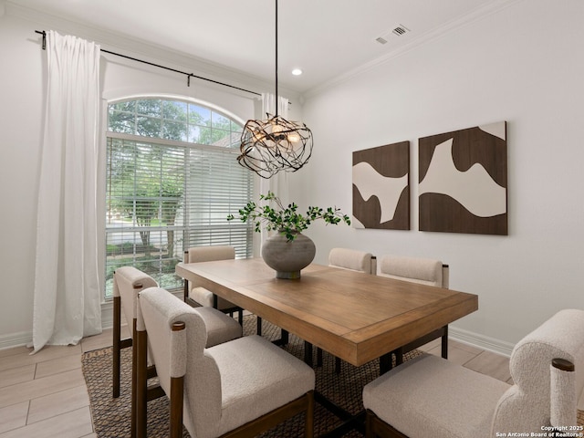 dining space featuring recessed lighting, baseboards, a chandelier, and ornamental molding