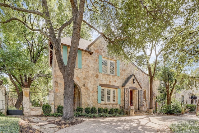 402 Thelma Dr, Olmos Park, TX 78212 - tudor house featuring stone siding