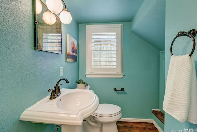 402 Thelma Dr, Olmos Park, TX 78212 - bathroom featuring wood finished floors, toilet, baseboards, a sink, and vaulted ceiling